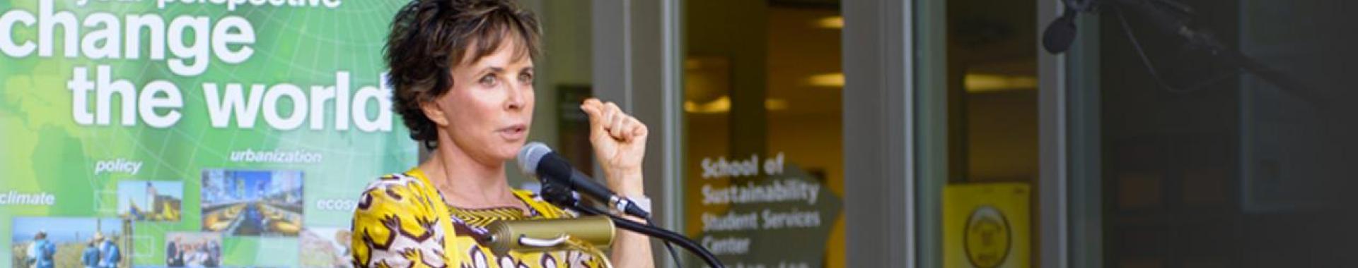Julie Wrigley speaking in front of Wrigley Hall at ASU's Tempe campus